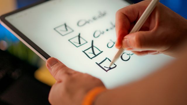 a person marking a checkbox